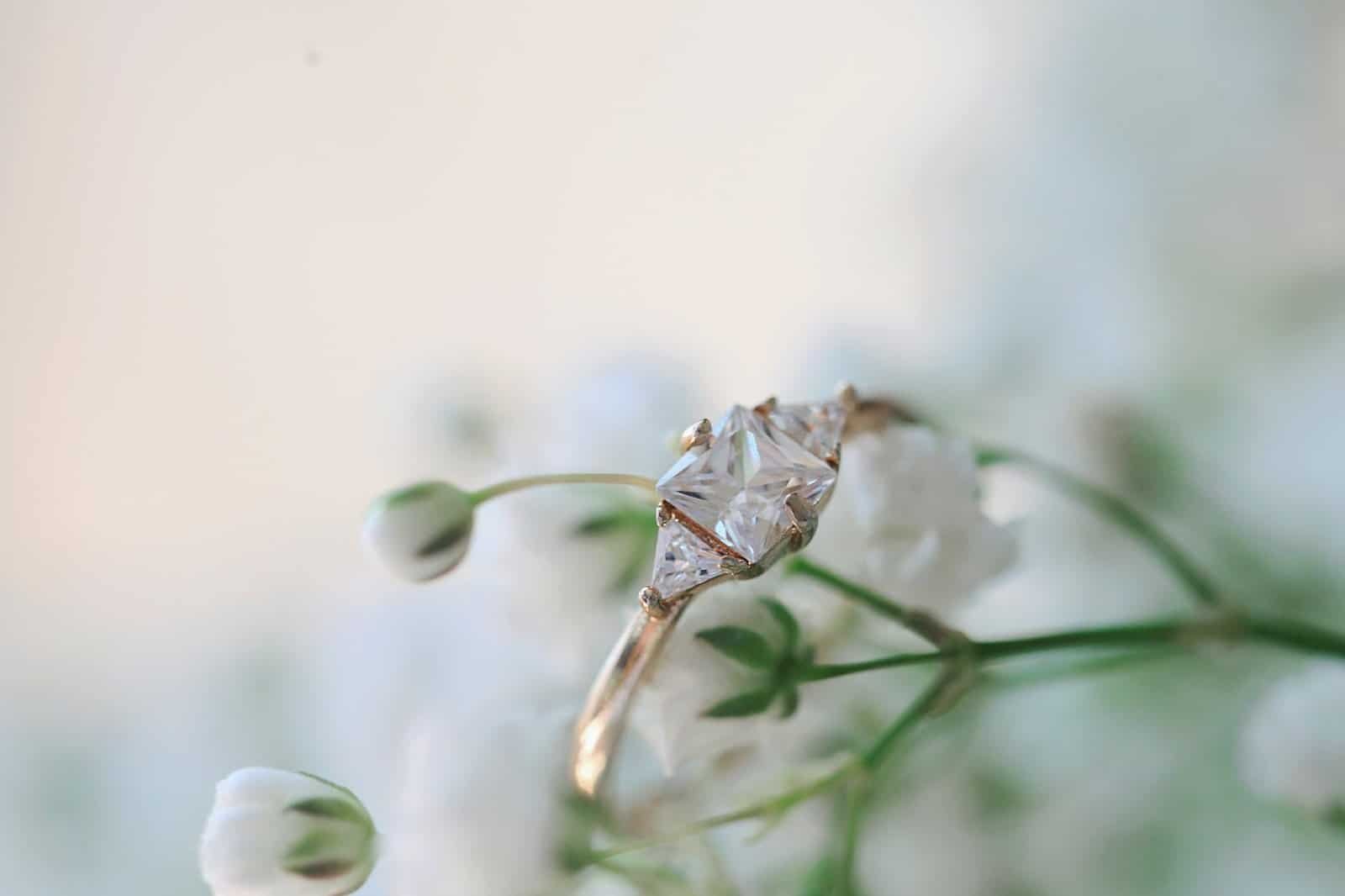 gold colored solitaire ring